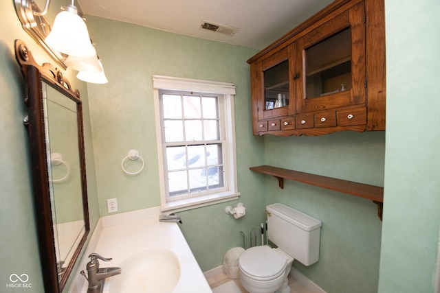 bathroom featuring sink and toilet