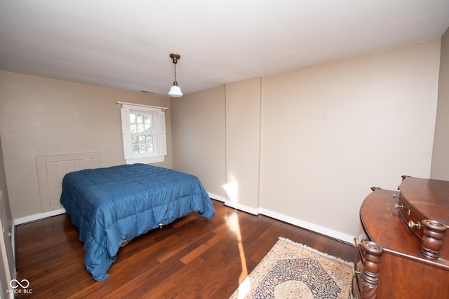 bedroom featuring dark wood-type flooring