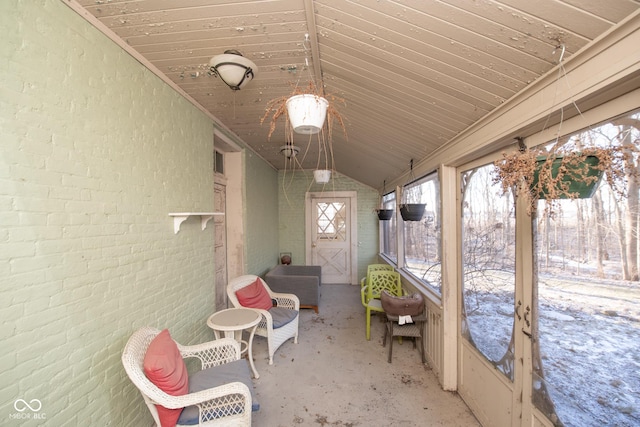 unfurnished sunroom with vaulted ceiling