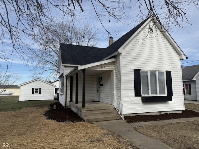 bungalow-style house featuring a front yard