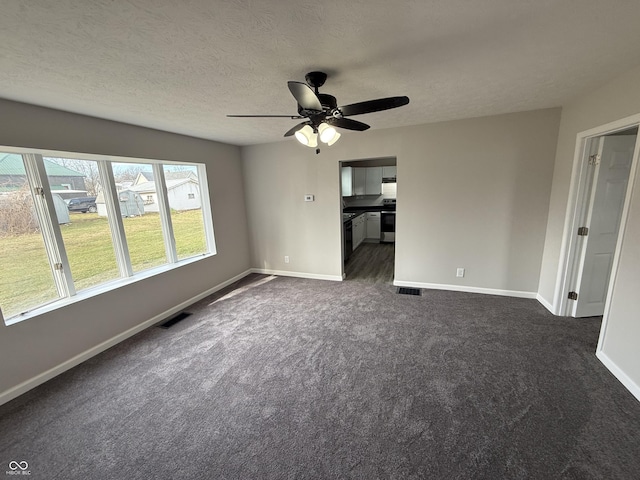 interior space featuring ceiling fan and a textured ceiling