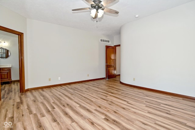 spare room with ceiling fan and light hardwood / wood-style floors