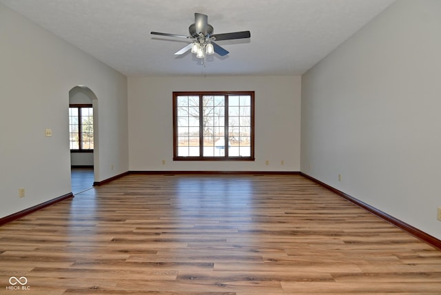 spare room with ceiling fan and light hardwood / wood-style floors