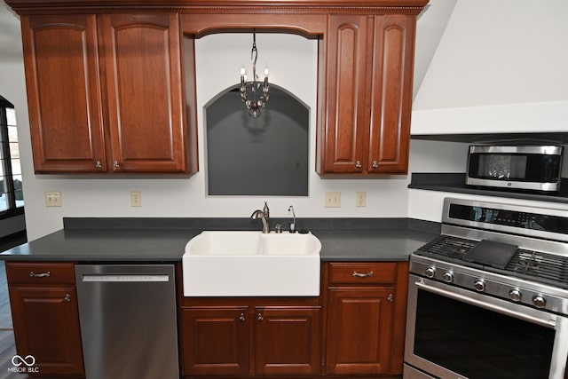 kitchen with sink, stainless steel appliances, and a chandelier