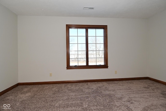 unfurnished room featuring carpet flooring