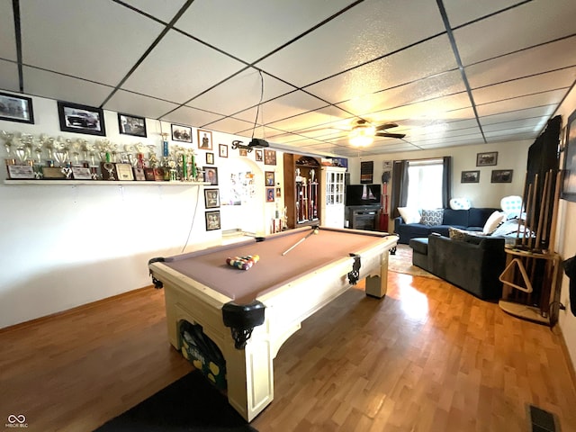 game room featuring a drop ceiling, hardwood / wood-style flooring, and pool table