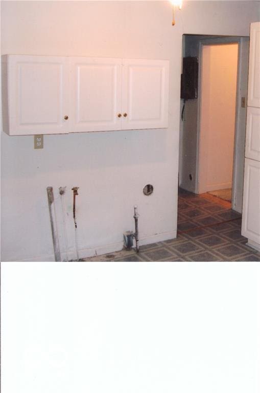 laundry room with cabinets