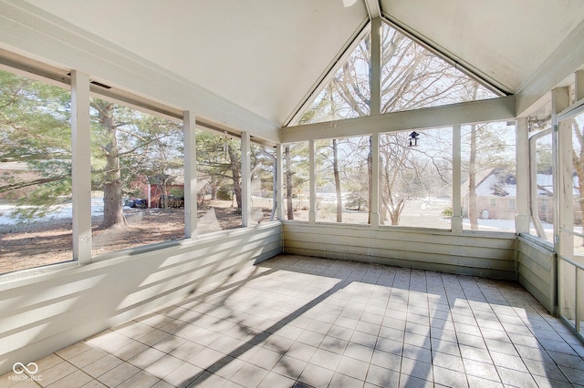 unfurnished sunroom with lofted ceiling and a healthy amount of sunlight