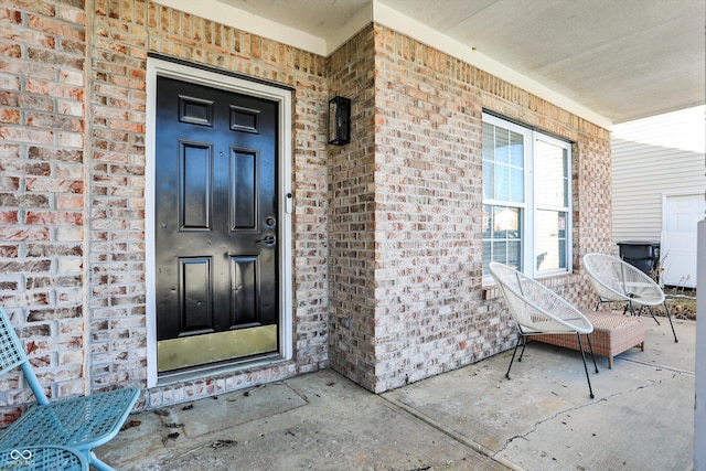 doorway to property with a porch