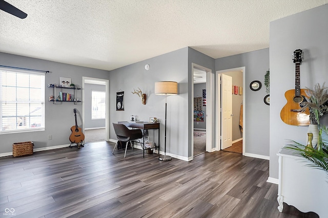 interior space featuring a textured ceiling and dark hardwood / wood-style flooring