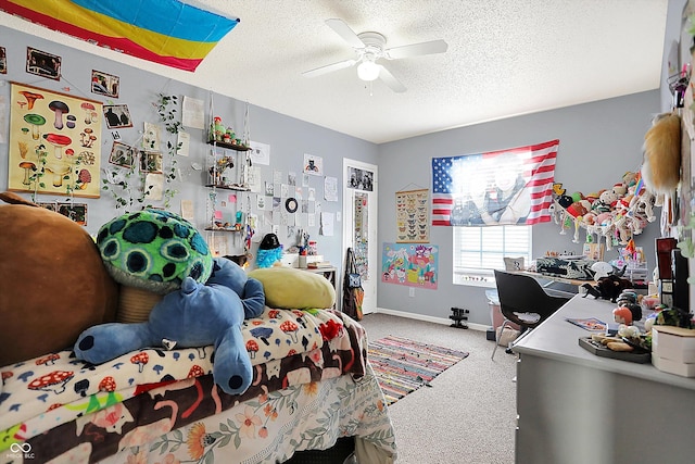 bedroom featuring ceiling fan, carpet floors, and a textured ceiling