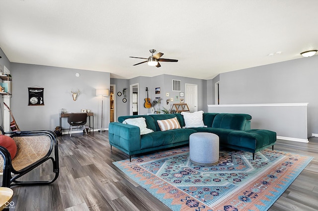 living room with ceiling fan and hardwood / wood-style floors