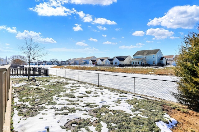 view of yard layered in snow