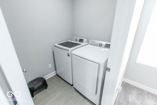 laundry room with independent washer and dryer