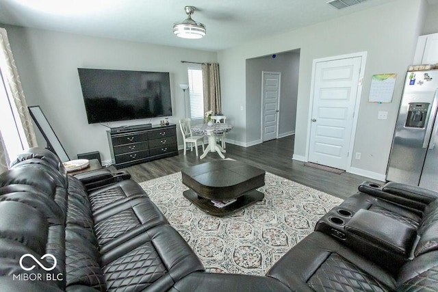 living room featuring dark hardwood / wood-style floors