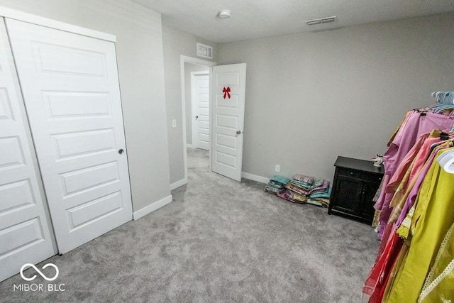 carpeted bedroom with a closet