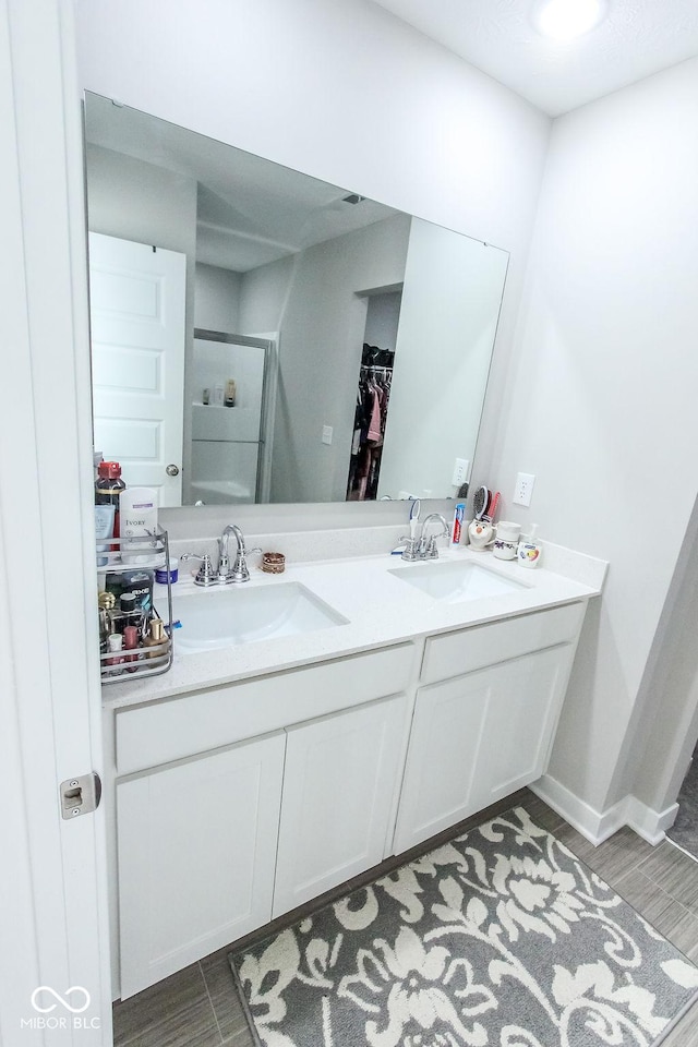 bathroom with vanity and an enclosed shower