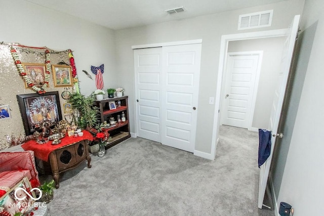 interior space featuring light carpet