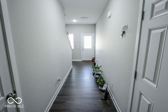 corridor featuring dark wood-type flooring