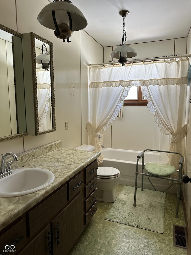 full bathroom with vanity, toilet, and shower / bath combo with shower curtain