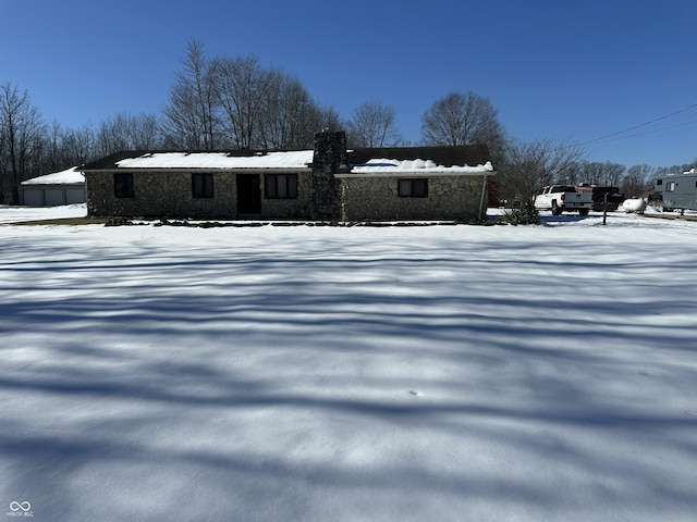 view of snow covered house