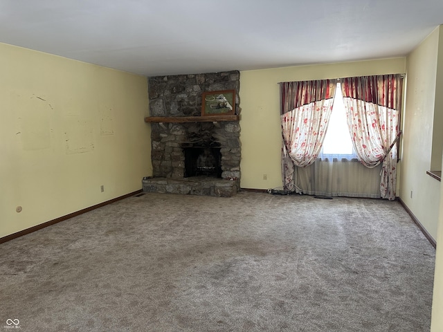 unfurnished living room featuring a fireplace and carpet