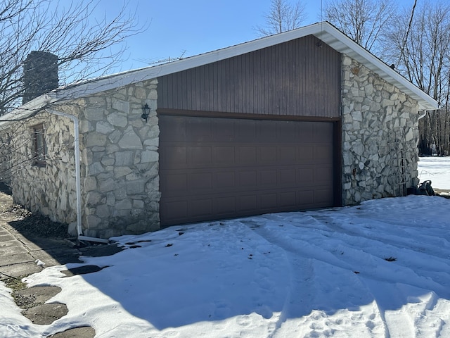 view of snow covered garage