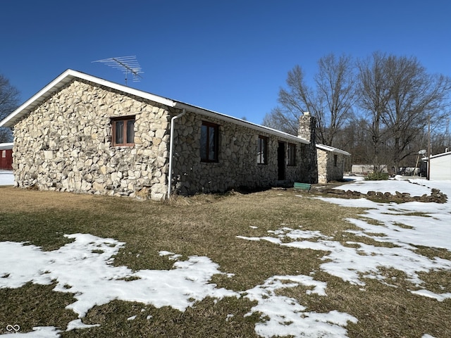 snow covered property featuring a yard