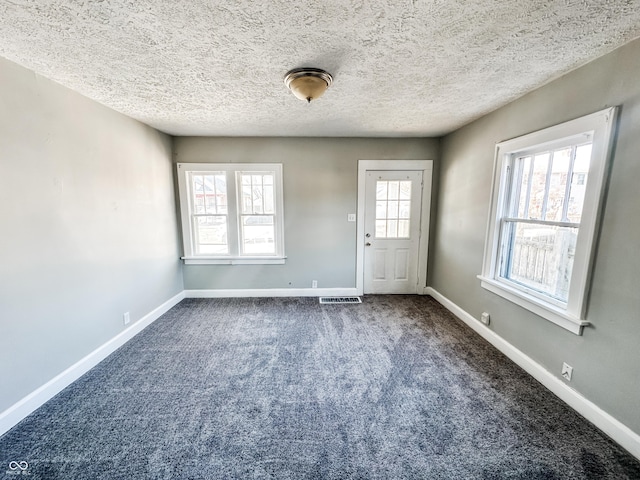 interior space featuring a textured ceiling