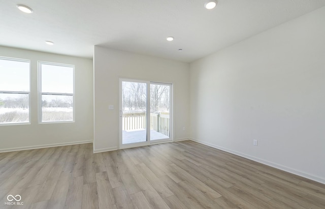 empty room with light hardwood / wood-style floors