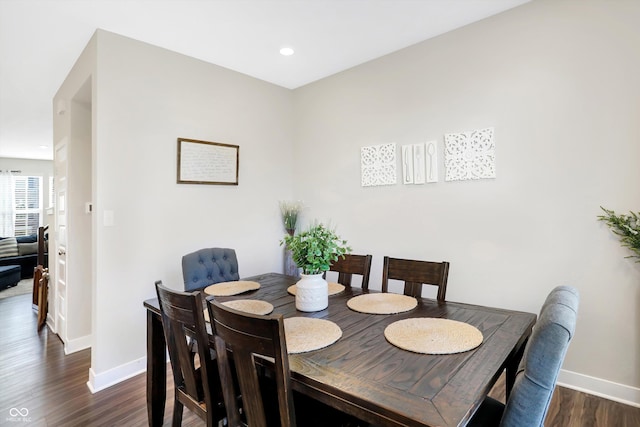 dining space featuring dark hardwood / wood-style flooring