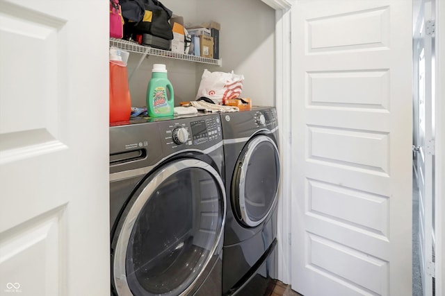 washroom featuring washer and clothes dryer