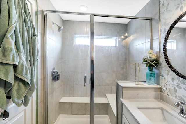 bathroom with an enclosed shower and vanity