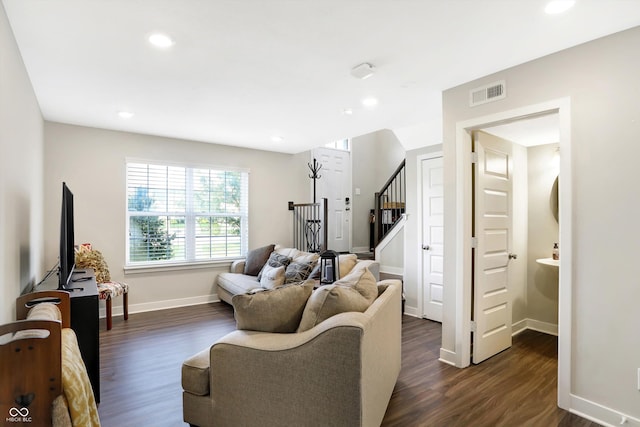 living room with dark hardwood / wood-style floors