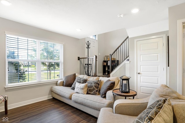 living room with dark hardwood / wood-style floors