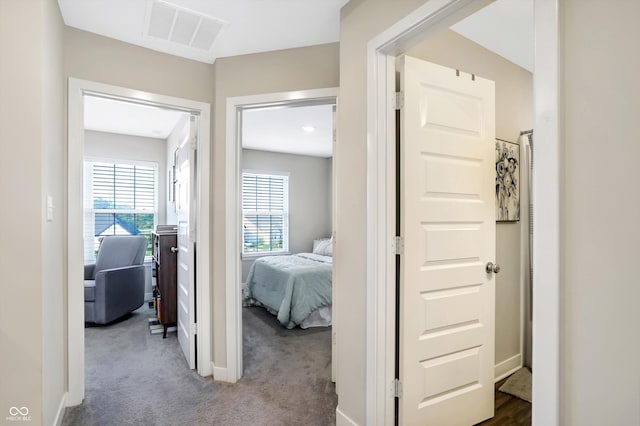 hallway featuring carpet