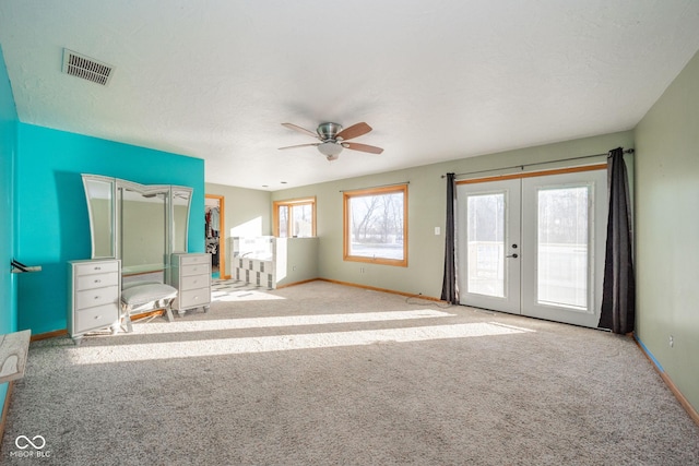 unfurnished bedroom with light carpet, access to outside, french doors, and ceiling fan