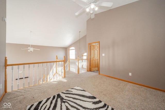 carpeted empty room featuring lofted ceiling and ceiling fan