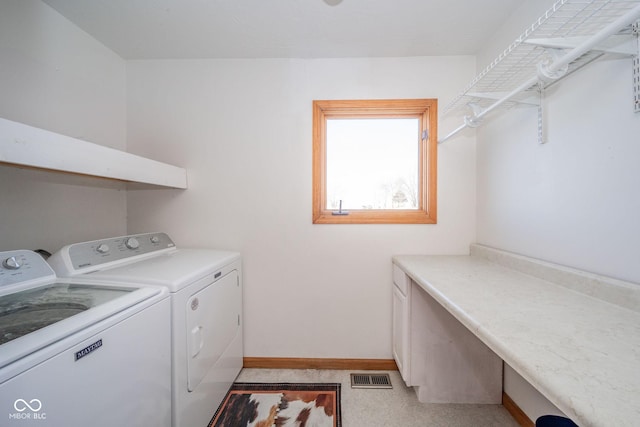 laundry room with separate washer and dryer