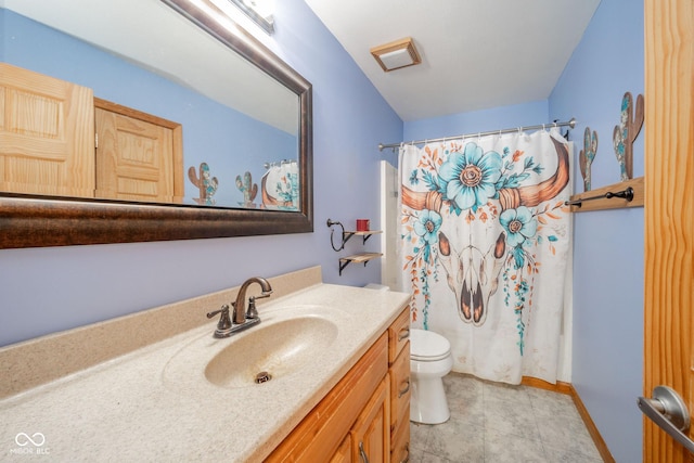 bathroom featuring vanity, tile patterned flooring, curtained shower, and toilet