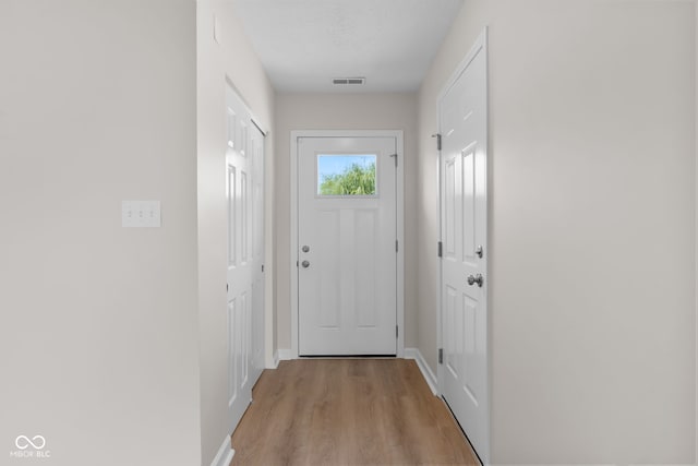 doorway to outside featuring light wood-type flooring