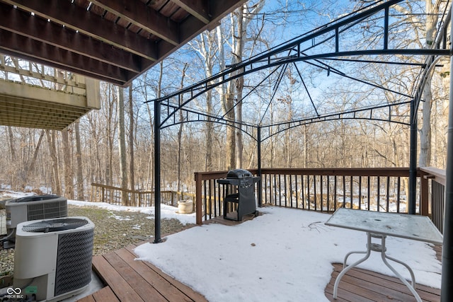 snow covered deck with central AC unit