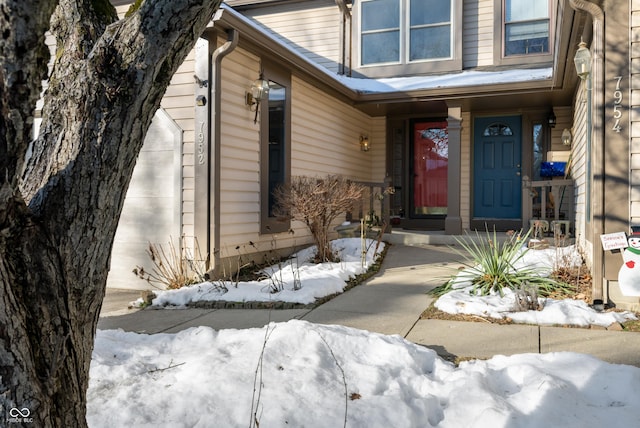 view of snow covered property entrance