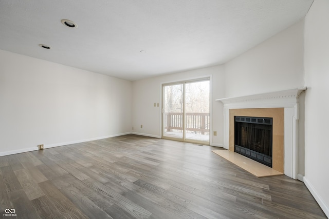 unfurnished living room featuring wood-type flooring