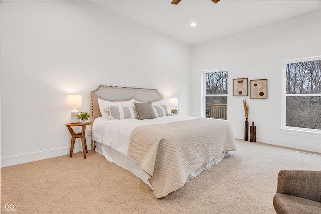 bedroom featuring light carpet and ceiling fan