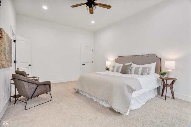 bedroom featuring ceiling fan and light colored carpet