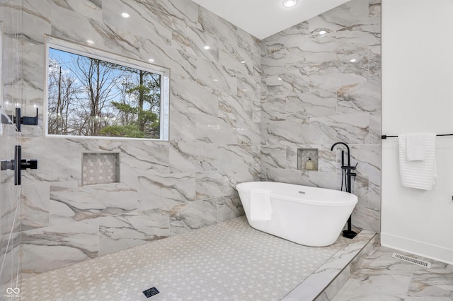 bathroom with a tub