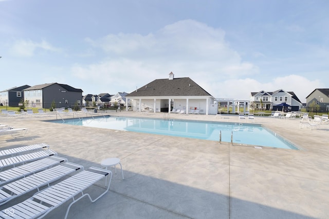 view of swimming pool with a patio area