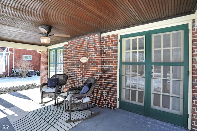 view of patio / terrace featuring a ceiling fan and french doors