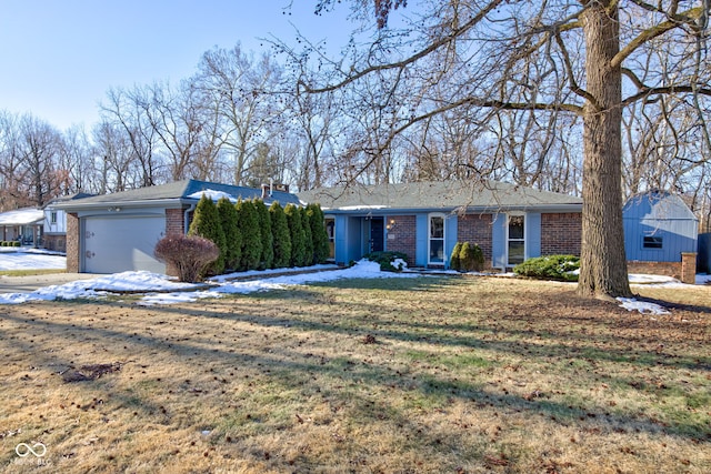 ranch-style house featuring a garage and a front yard